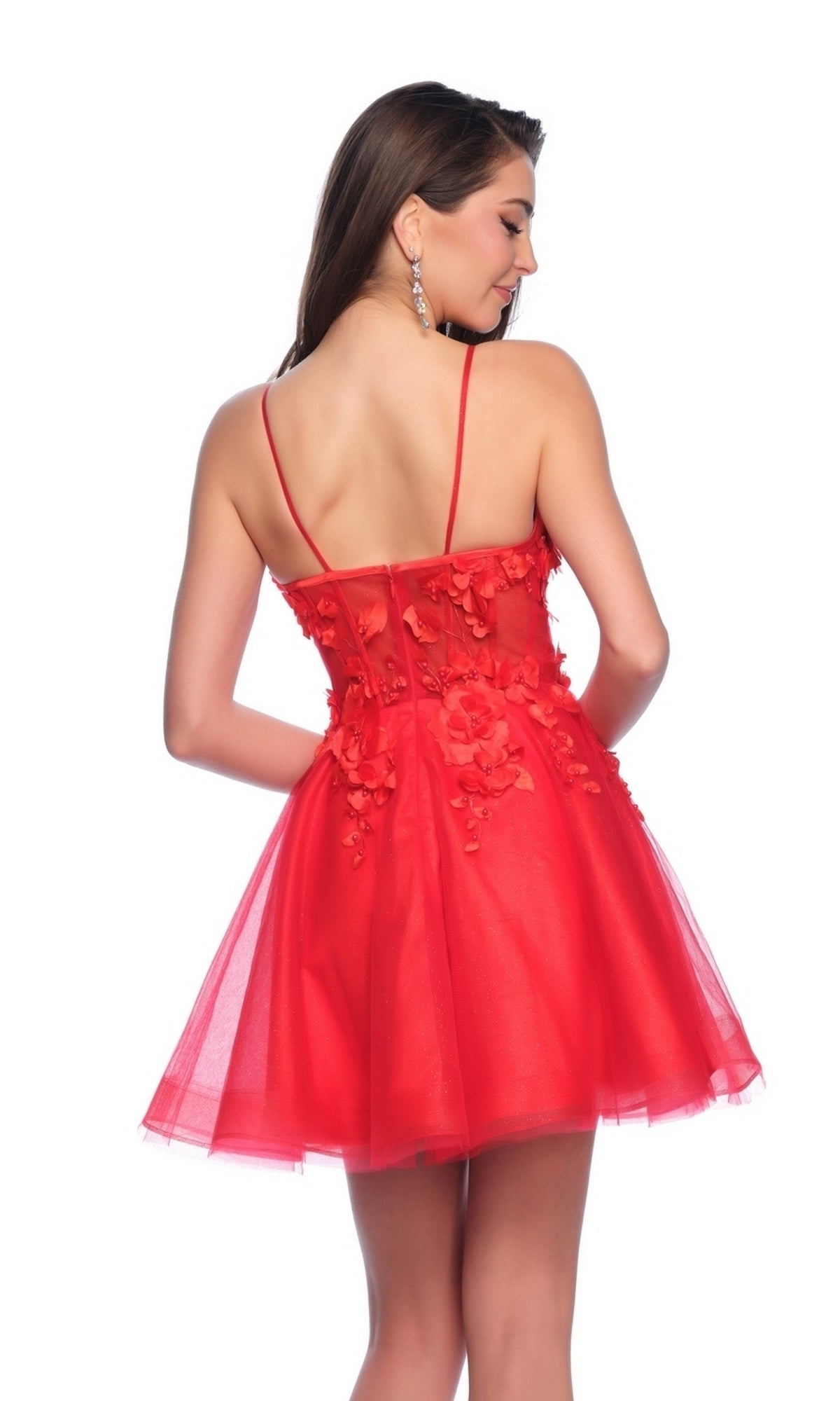 Woman wearing the Dave and Johnny Short Red Floral Hoco Dress 11726, featuring thin straps, floral appliqué, a corset bodice, and an open back, standing and looking over her shoulder.